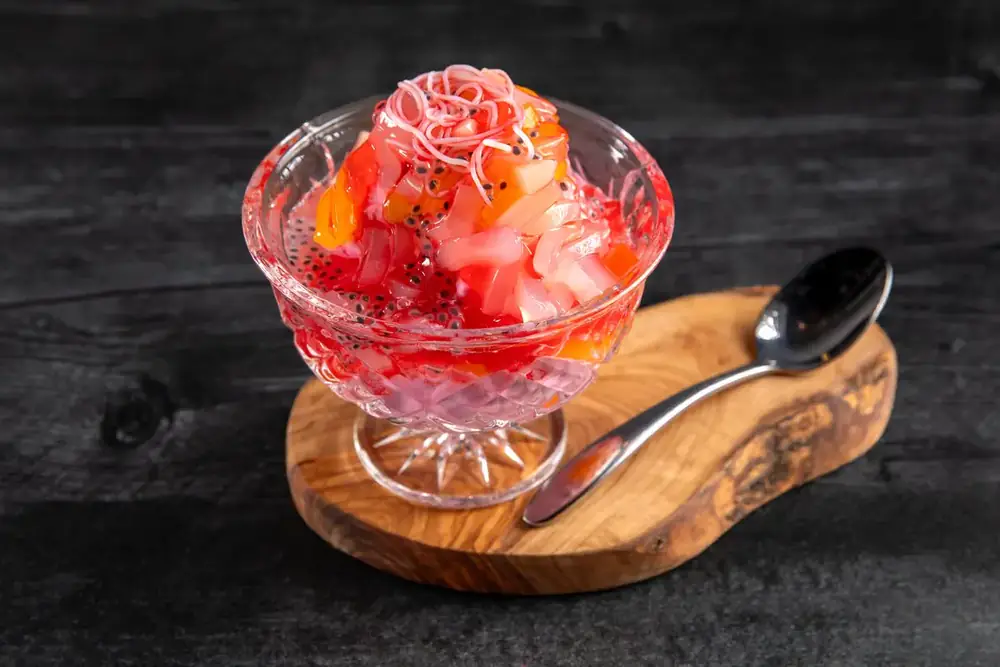 A glass of rose falooda with ice cream